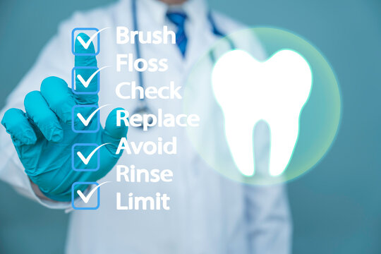 
Dentist showing virtual infographic with tooth health care tips brush floss rinse check limit avoid replace for oral hygiene and dental protection