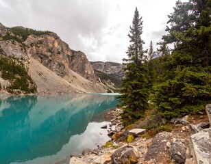 Tranquil alpine lake reflected in the clouds