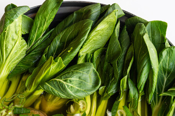 bok choy in the pan for kalguksu noodle soup