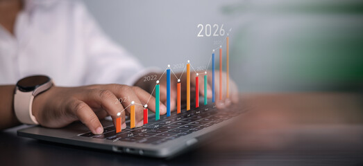 Person Working on Laptop with Virtual Graphs and Charts for Business Growth and Financial Planning...