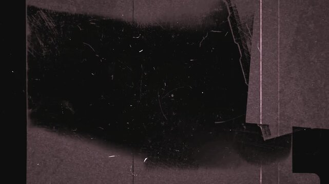 Damaged old film reel scratched dark grainy texture deterioration decay faded antique movie reel celluloid vintage photo negative cinematic artifact broken fragmented filmstrip