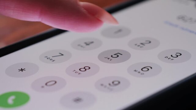 Close up of finger dialing pin or phone number on screen smartphone. High quality 4k footage