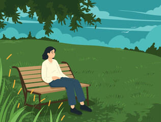 young woman crying alone in landscape Beautiful landscape and view with sun in background. Unhappiness