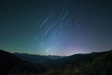 A breathtaking starry sky with trails lighting up the night landscape