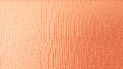 Fototapeta premium Rose gold silk fabric texture with smooth folds and shiny surface, elegant luxury background for design and decoration.