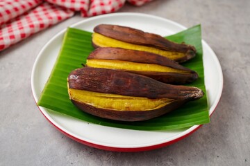 Grilled Banana in white plate 