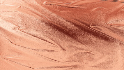 Rose gold silk fabric texture with smooth folds and shiny surface, elegant luxury background for design and decoration.