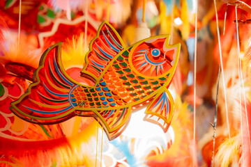 Colorful carp-shaped lantern for Mid-Autumn Festival, traditional handmade decoration symbolizing luck and festivity.