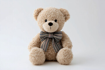 Obraz premium Cute Beige Teddy Bear with Plaid Bow and Big Head on White Background