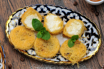 oriental sugar treats in a plate photo on a dark background