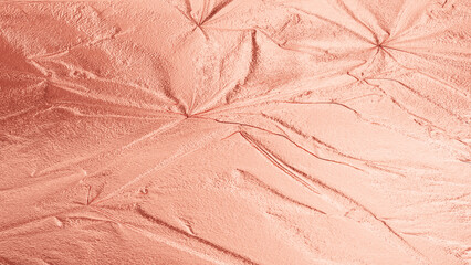 Rose gold velvet fabric texture with soft folds, shiny metallic surface, elegant abstract background for design and decoration.