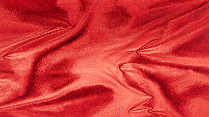 Rose gold velvet fabric texture with soft folds, shiny metallic surface, elegant abstract background for design and decoration.