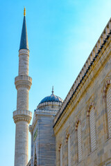 View of the minaret and wall of the Blue Mosque or Sultanahmet from the courtyard, Istanbul, Turkey.