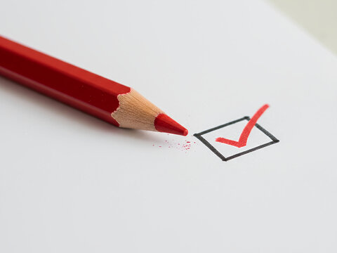 AI generated. A red pencil  on a white paper for voting, elections.