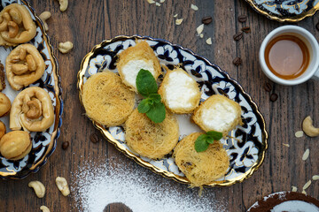 Turkish delicacy sugar pohlava with cream in a plate on a macro background