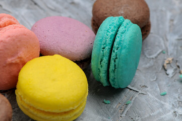 colorful macaroons on a gray background macro photo