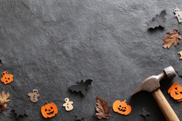 Halloween DIY Craft Project with Hammer Pumpkins Bats and Autumn Leaves on Dark Background.