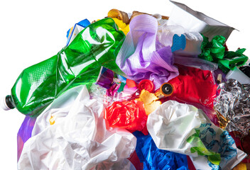 Garbage pile close up with crushed green bottle and wrappers. Concept of waste pollution...