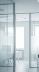 Fototapeta premium Modern office interior with glass partitions, creating a bright and spacious workspace with natural