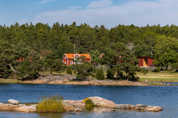 Stendorren, Sweden A view of a red house and barn in the Stendorren Nature Reserve.