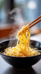 Steaming noodles chopsticks hot soup black bowl comfort food Asian cuisine lunch dinner savory soft texture. Steaming noodles lifted by chopsticks black bowl, hot soup aroma rising, cozy indoor