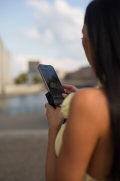 young woman using laptop on the beach