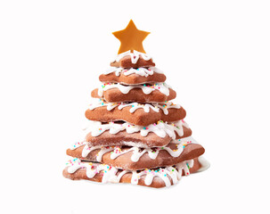 Tasty ginger and honey Christmas tree shaped cookie with white icing. Isolated on white background. Holiday concept.