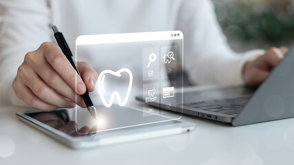 Digital dental technology concept with a doctor using tablet and laptop, tooth healthcare icon, online consultation, telemedicine service, modern medical innovation, and oral care.