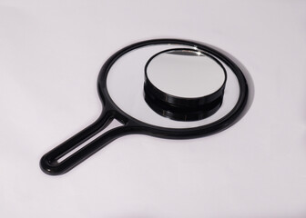 magnifying glass on white background. Two mirrors 