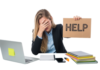 Stressed blonde caucasian businesswoman in suit covers face, holding 'HELP' sign on cardboard at desk, laptop, white background, concept of work burnout