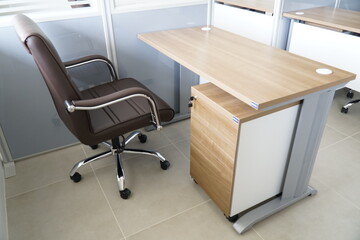 Wooden desk with a chair and a drawer