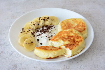 Delicious Breakfast Cheese Pancakes with Banana and Cream and chocolate chips