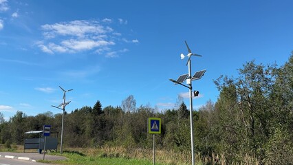 Fototapeta premium Solar and wind-powered street lights are innovative solutions that provide reliable illumination, cut energy consumption, and support efforts to combat climate change.