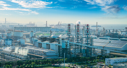 Large industrial plant with smoke stacks and complex machinery.