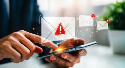 Person using smartphone to check email notification with a red warning sign on the envelope, concept of urgent message or spam alert
