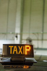 Modern taxi roof indicator glowing free with occupant number, symbol of urban mobility and transport.