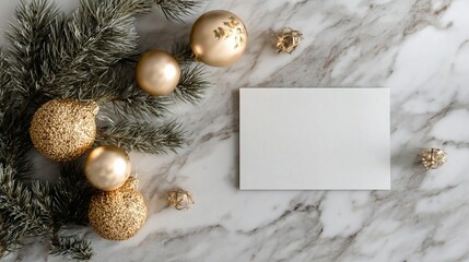 Elegant Christmas composition with golden ornaments and pine branches on marble background, featuring a blank white card for personalized holiday message