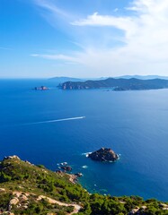 High-angle view of a vibrant blue sea with islands and a clear sky