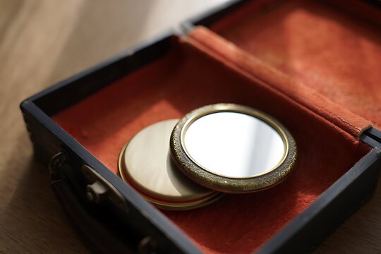 Antique pocket watch components in a velvet lined box