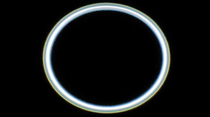 Neon fiber ring orbiting central blur zone with empty right-third 