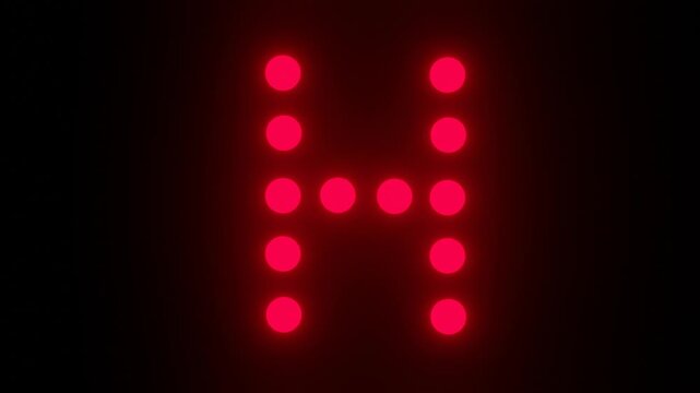 Flashing red dot matrix letter H on black background