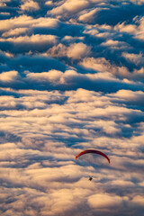 Paragliding over the sea of clouds in sunset light, in El Teide National Park, Tenerife Island, Spain, Europe