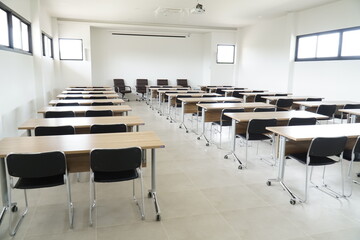 Large room with many desks and chairs