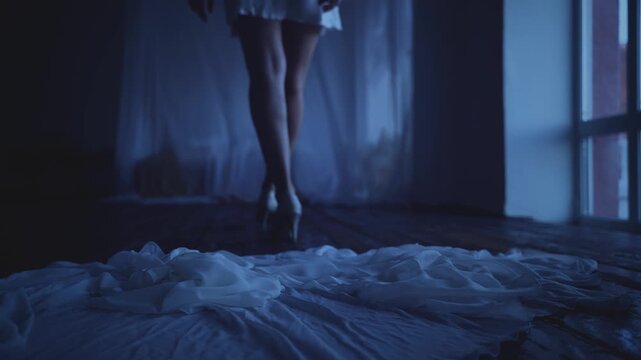 Beauty adult woman throws off dressing gown silk peignoir robe goes to sleep on canopy bed in short hot dress, white curtains fly wind, window dark room night blue light. girl sexy body back rear view