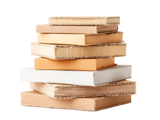 A stack of cardboard boxes with books on top