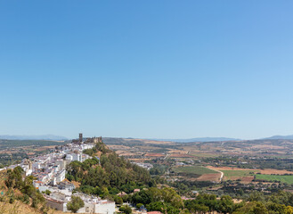 Obraz premium Arcos de la Frontera hilltop view with castle and whitewashed houses, Andalusia Spain. 4 September 2025.