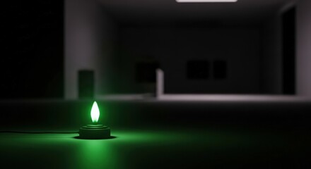 Single green light emitting diode lamp illuminating a dark room offering a sense of hope and electricity outage concept.