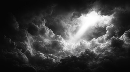 Obraz premium Dramatic Black and White Cloudscape with Ray of Light Breaking Through