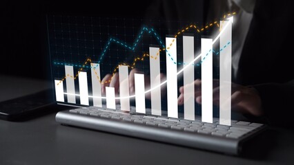 A modern interactive display showcasing business growth trends with vibrant statistics overlays on a sleek keyboard, representing technology and finance synergy. Copula