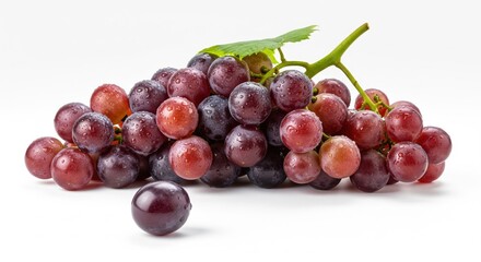 Fototapeta premium Close-up of a vibrant bunch of red grapes with water droplets, featuring a single grape detached in the foreground, on a clean white background displaying fresh and juicy fruit .